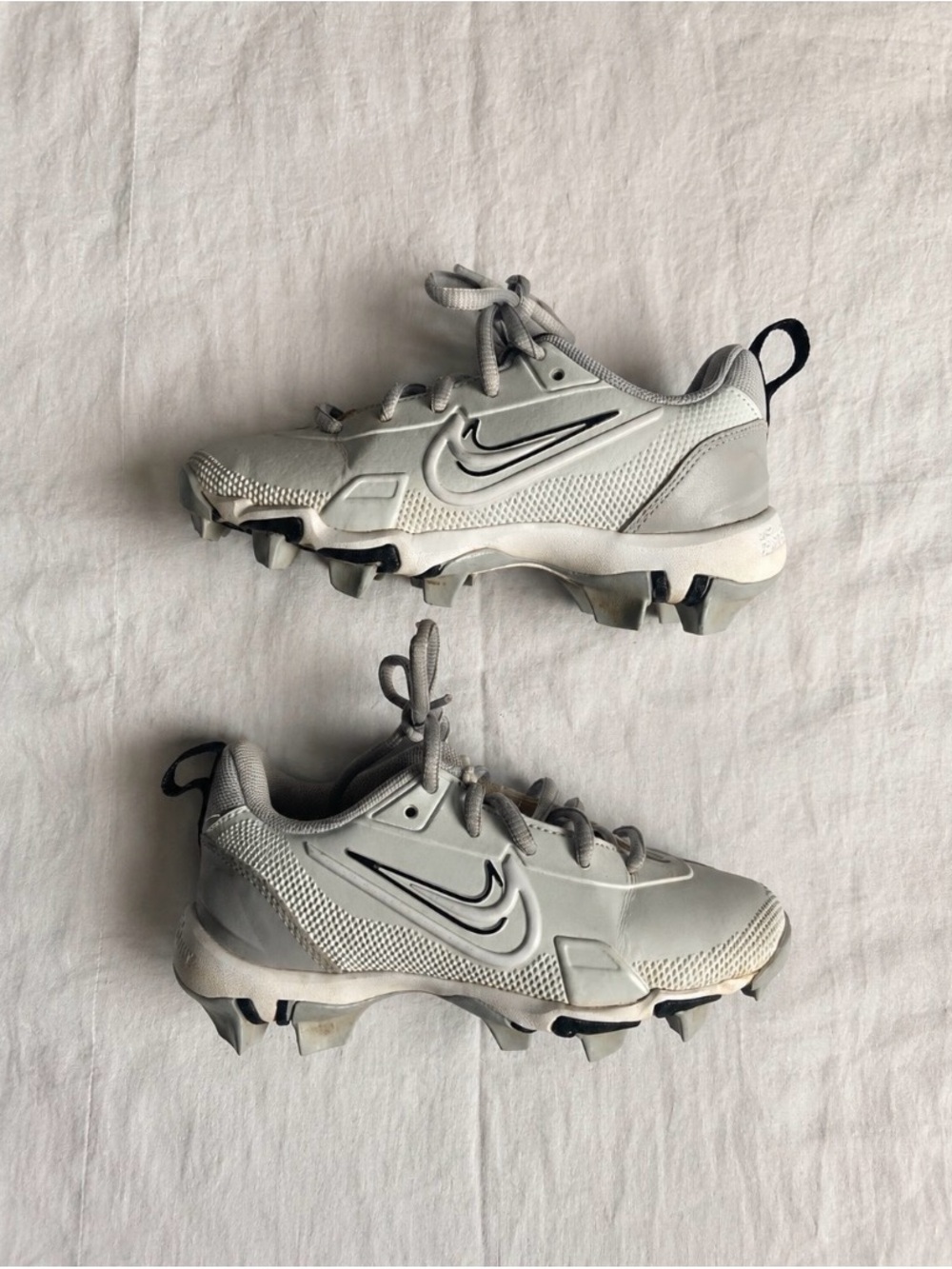 Nike Kids Gray Cleats with Black Swoosh